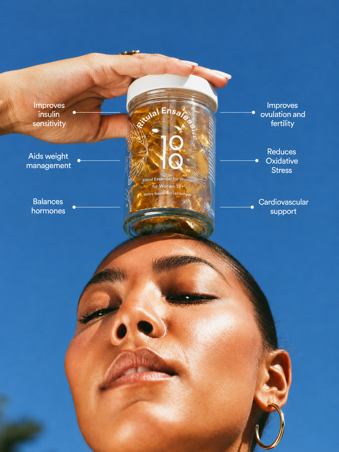 Woman balancing emberly PMOS Support berberine bottle on her head against a blue sky